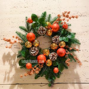 Christmas Wreath with Orange and Gold Ornament